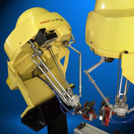 Advanced FANUC-made robotic systems inspecting and assembling a printed circuit board.
